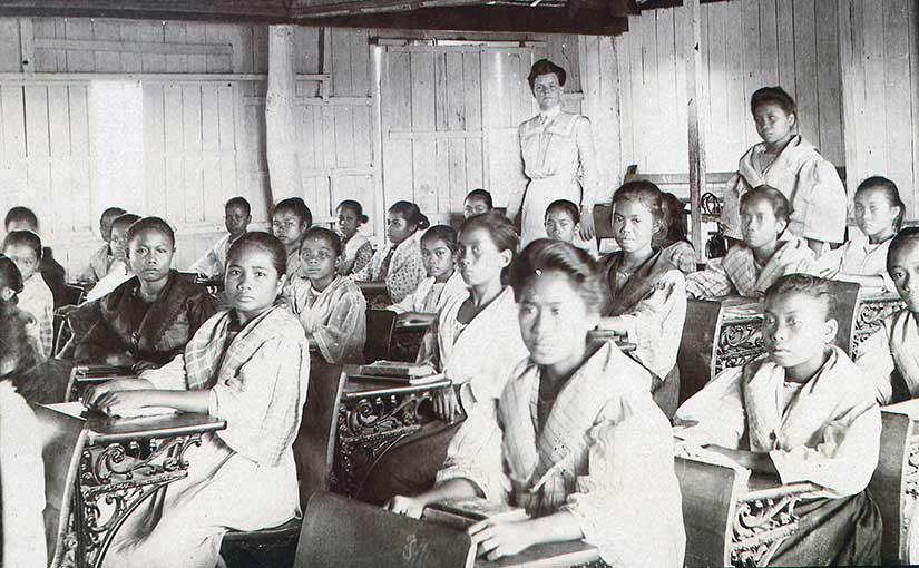 An American teacher, Mary Scott Cole, is pictured with her class in Palo, Leyte. Photo from the University of Michigan Bentley History Library.