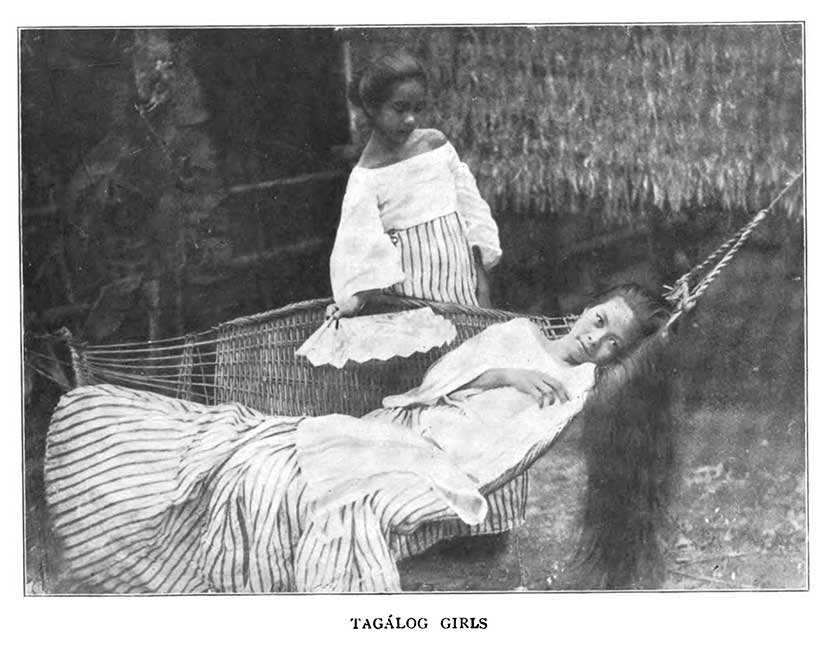 Filipina girls women in hammock posing for American photographer during colonial Gilded Age
